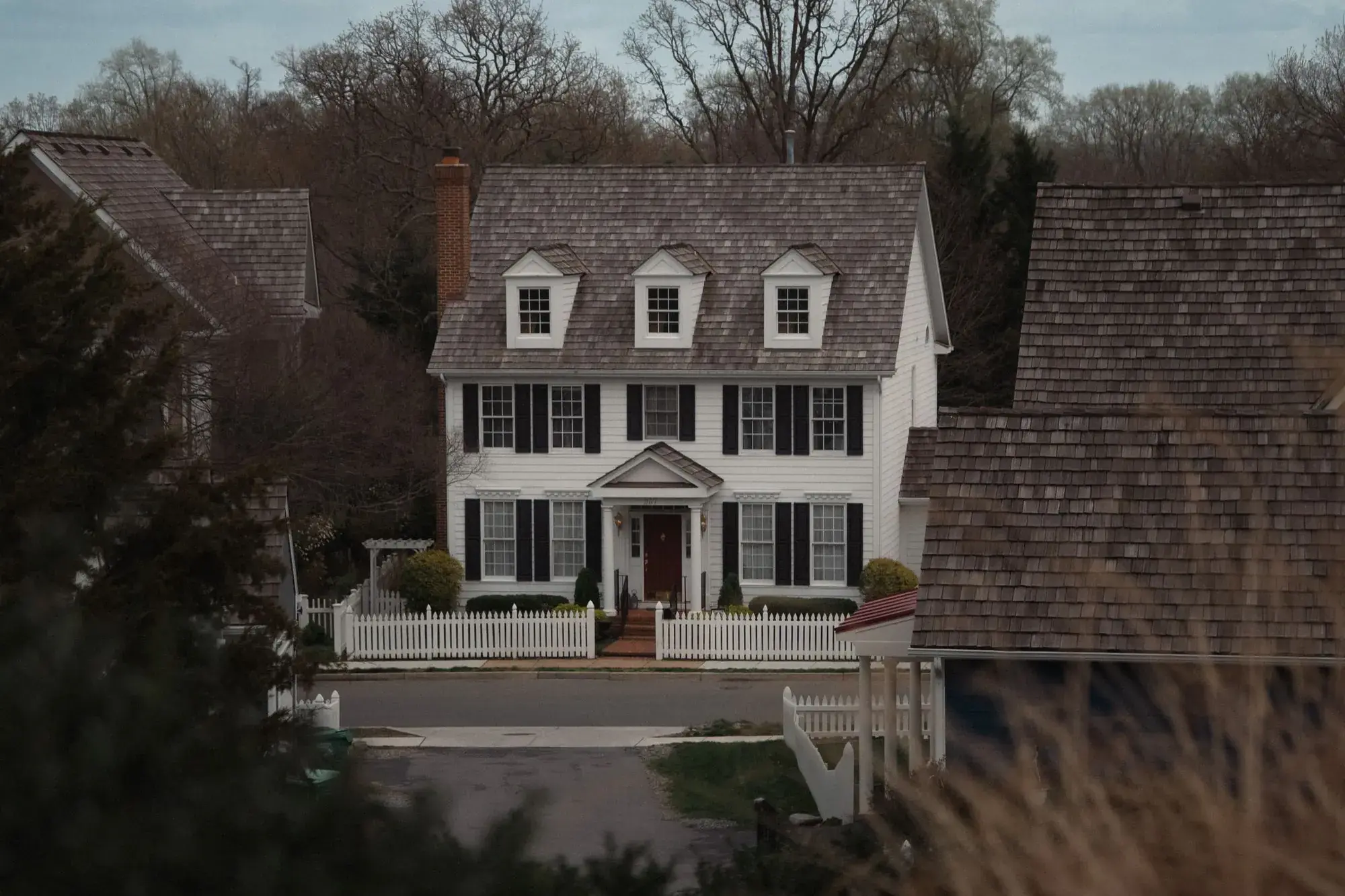 Colonial-style house in a suburban neighborhood